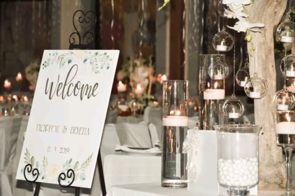 room with candles and table setup with welcome board